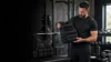 Buyer comparing different weighted vest styles in a gym before choosing the right vest